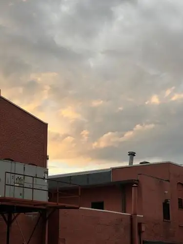 Muted hues of city brick and a fading sky.